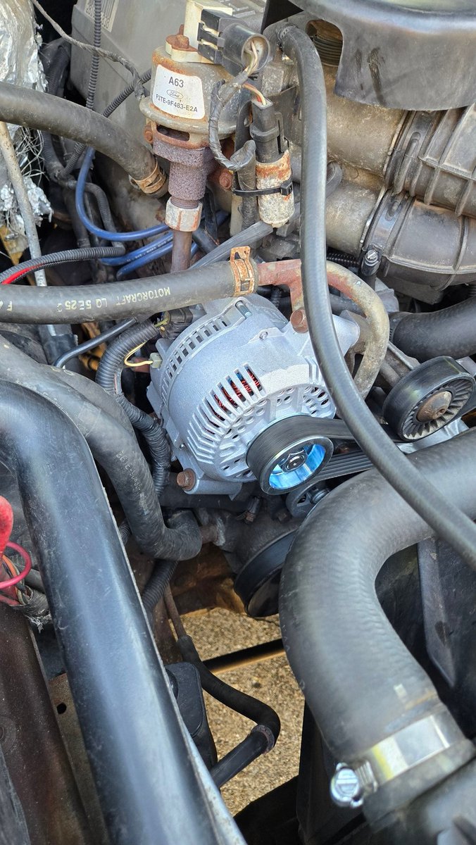 obs_dad's tweet photo. Pretty easy alternator replacement on the F-150 yesterday. Learned the hard way that the line above the alternator contains coolant. Should have googled it first! https://t.co/RkH4UBY7zD