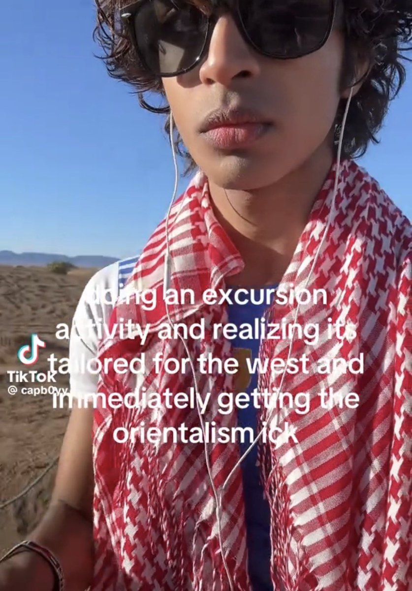 Headphones on on the camel getting the ick about the west