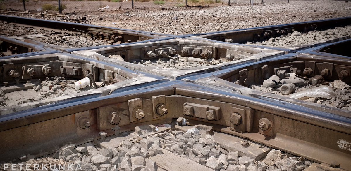 PeterKunka's tweet image. Found this railroad diamond crossing in Phoenix.  Really interesting and made for a few nice photos.  #railroad #diamond #crossing #train #tracks #UnionPacific #Phoenix #Arizona #Fuji #X100S #Nikon #SB800