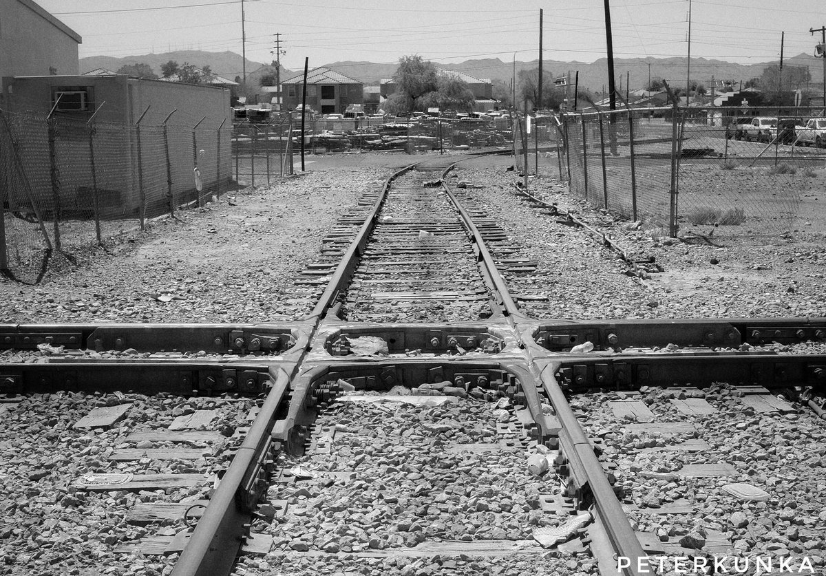 PeterKunka's tweet image. Found this railroad diamond crossing in Phoenix.  Really interesting and made for a few nice photos.  #railroad #diamond #crossing #train #tracks #UnionPacific #Phoenix #Arizona #Fuji #X100S #Nikon #SB800