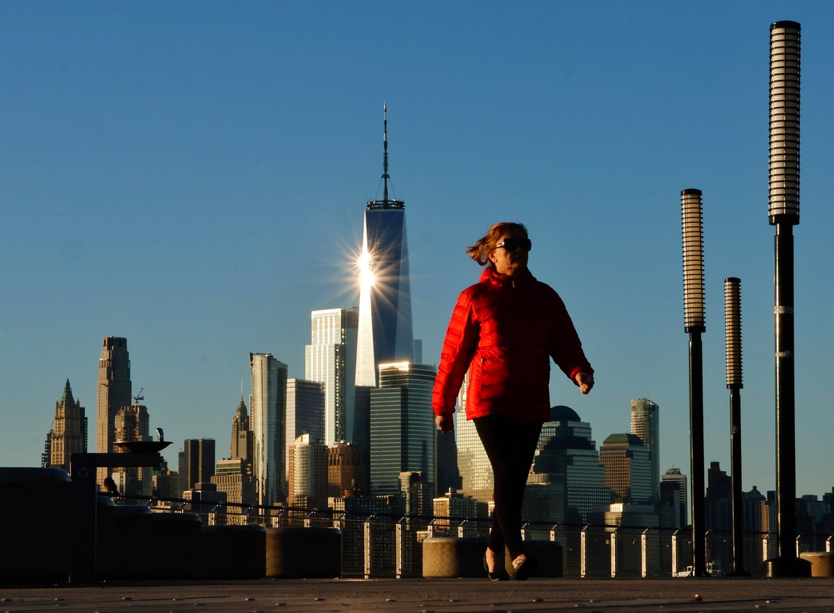 GaryHershorn's tweet image. The sun reflects off of One World Trade Center as it rises in New York City, Tuesday morning #newyorkcity #nyc #newyork #sunrise