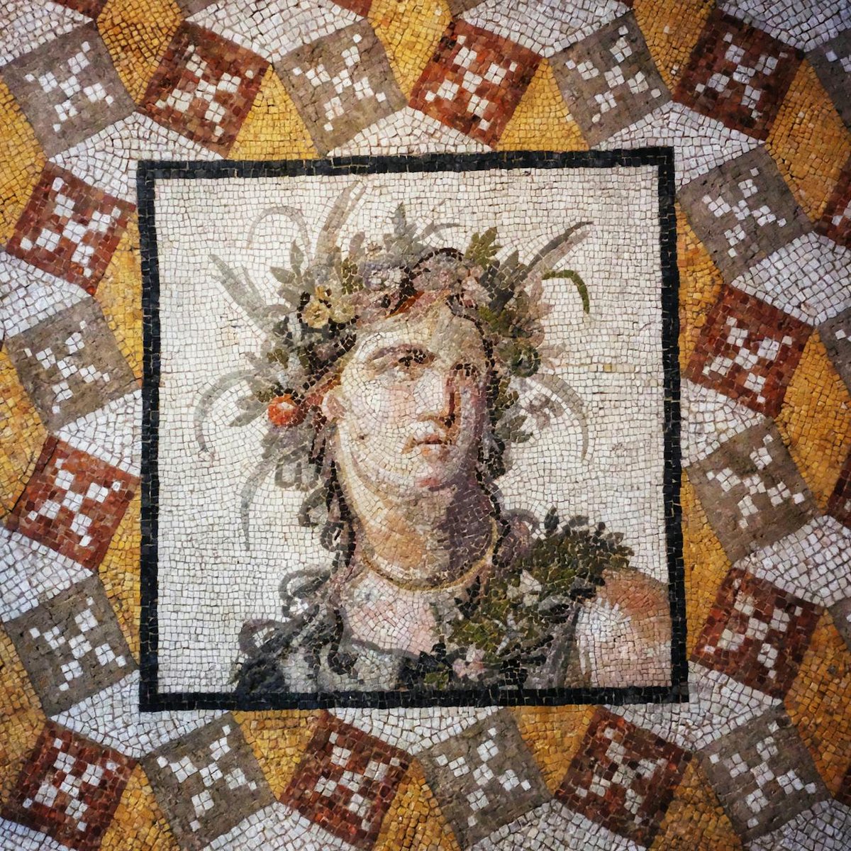 A Roman floor mosaic from a villa near ancient Antioch, now in The Metropolitan Museum of Art, New York.

Dating to the 2nd century AD, the mosaic was found during excavations at Daphne, the wealthy resort suburb of Antioch near modern Antakya, Türkiye. At its center is the bust