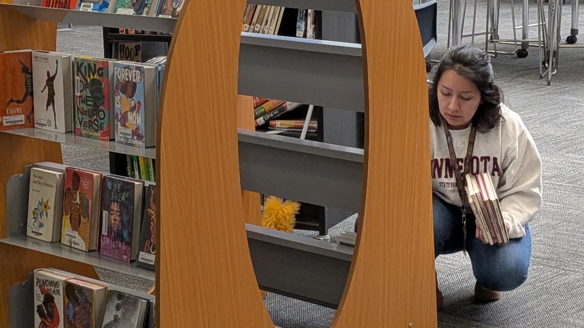 MnDeptEd's tweet photo. Meet a future school librarian! Amanda Lara is working as a para as a media clerk at Rosemount-Apple Valley-Eagan Public Schools as she works toward a dual teaching and library media specialist degree! #MNSchoolLibraries #SchoolLibraryMonth https://t.co/G79TKeQQ6H