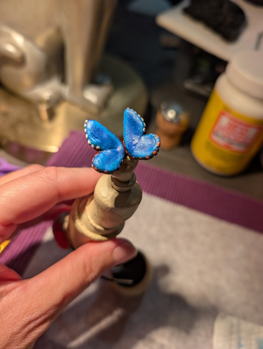 JeNeSaisJordan's tweet photo. He got magnets glued to his bottom &amp; a paint job. Painting took a few days (acrylic). I assumed I'd paint a very generic blue butterfly, but seeing his desk &amp; the fact a blue morpho's under wings look not unlike abstraction I knew despite my shaky hands it had to be a blue morpho https://t.co/JHsVuxq7O1