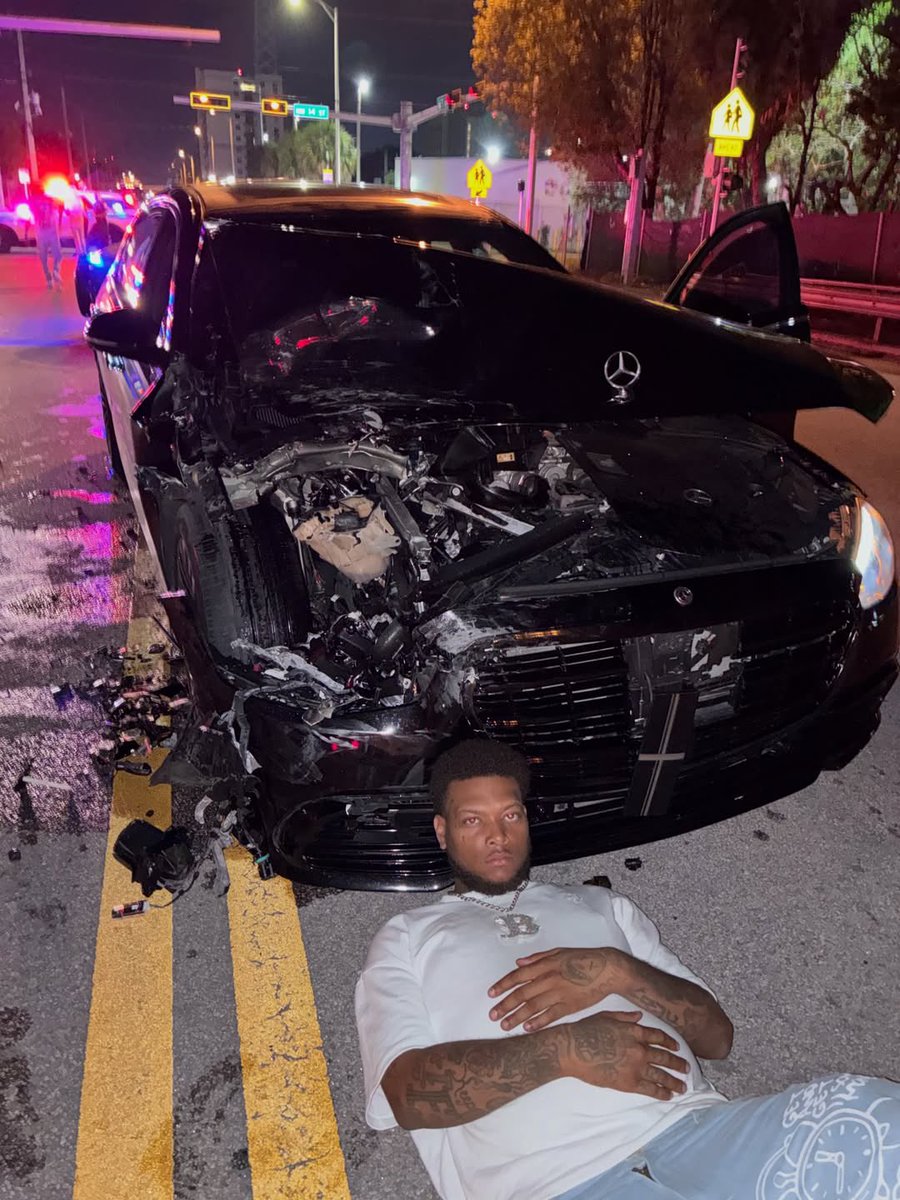 TRIGGERHAPPYV1's tweet photo. This man took one last photoshoot with his Mercedes Benz after totalling it in a serious crash and thanks god for protecting him https://t.co/DFtXd2yS2S