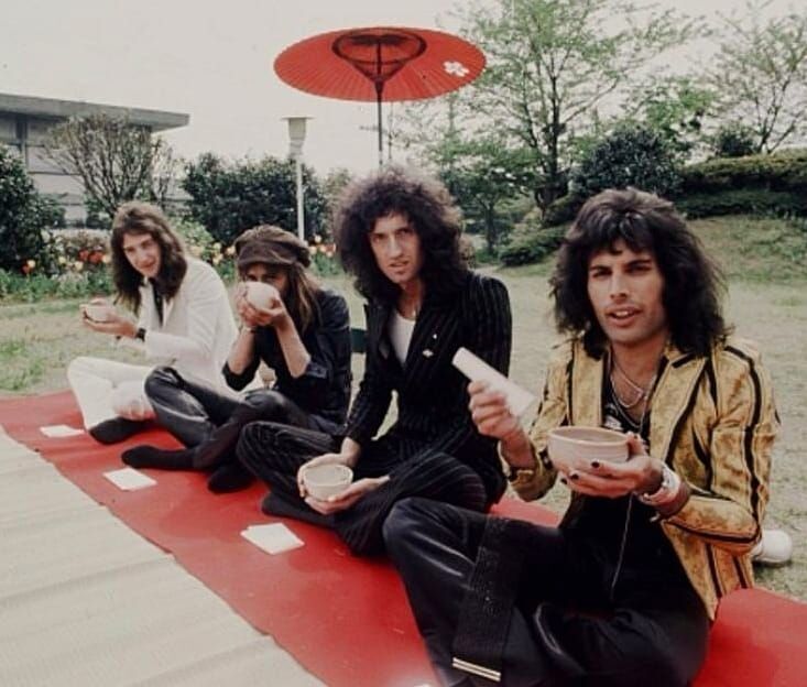 Queen experiencing a traditional tea ceremony in Tokyo in April 1975. Legendary rock photographer Koh Hasebe captured John Deacon, Roger Taylor, Brian May, and Freddie Mercury during their very first Japanese tour. The band was famously shocked by the massive, screaming crowds