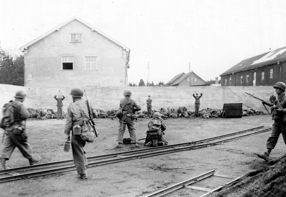 WWIIpix's tweet image. This day in 1945, the Dachau liberation reprisals.   

Shocked, disturbed, and angered at finding the massed corpses of internees, American soldiers executed German soldiers and SS guards in the camp’s coal yard. Others were beaten to death by liberated prisoners. #WW2