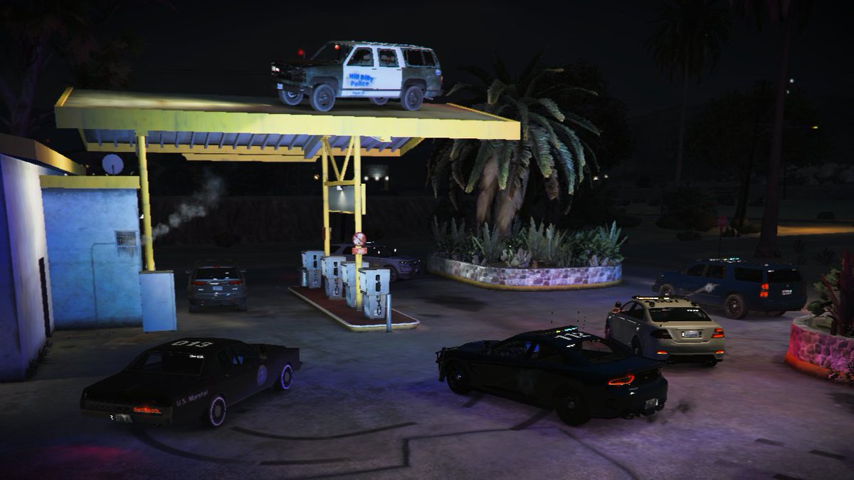 Trying2RolePlay's tweet photo. Our active LEO units have surrounded a HillBilly Police Department (HBPD) officer caught on the canopy of a gas station—criminal activity unfolding live!

Join the chaos, the drama, and the thrill of true roleplay. Are you ready to step into the action? 

#FiveM #GTA5RP #Roleplay https://t.co/Dzp7wEt2yK