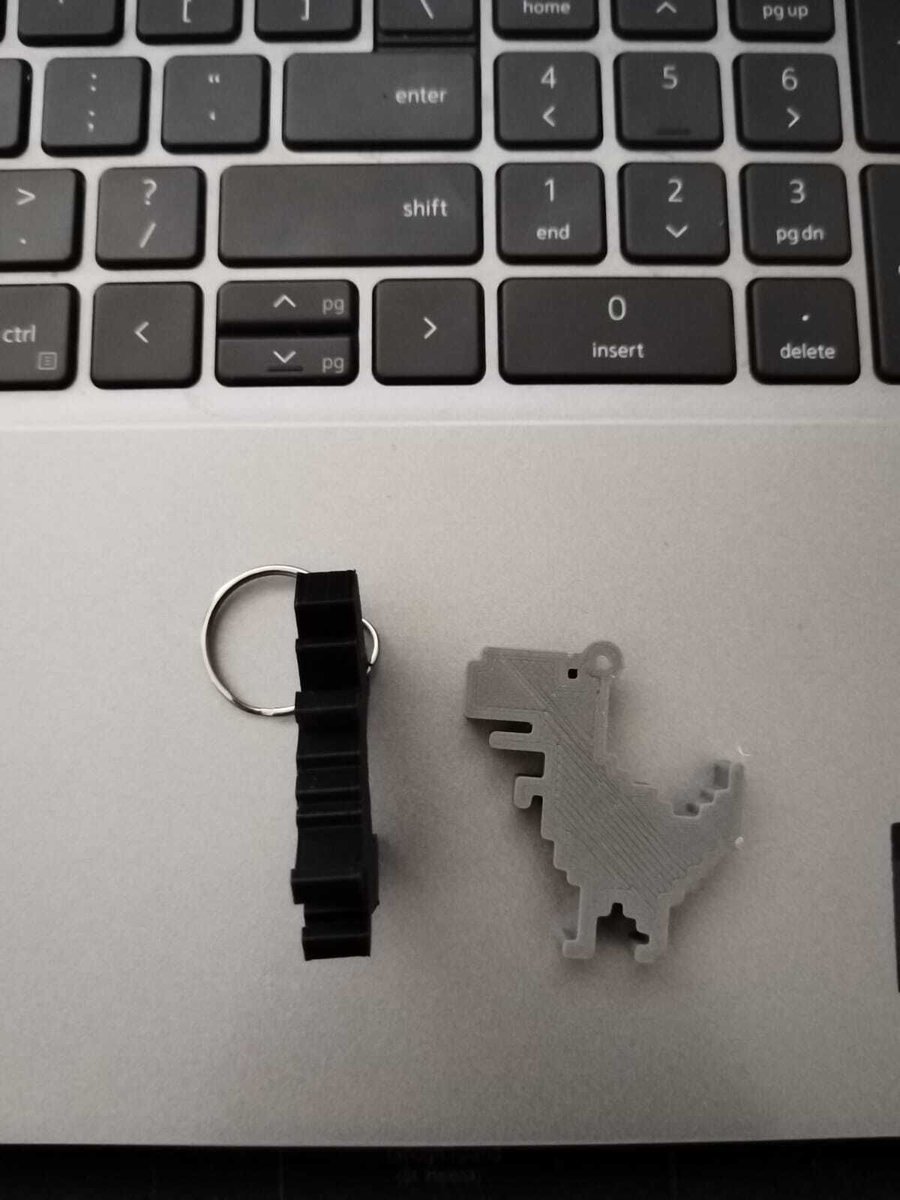 devconfza's tweet photo. Tonisha Govender combines her love of making things with her passion for great engineering. She's making dino keyrings to give away at her #DevConf talk about rediscovering the fundamentals that make great developers great. Don't miss it! 🦕 #DevConf https://t.co/BU6SO8fKnt