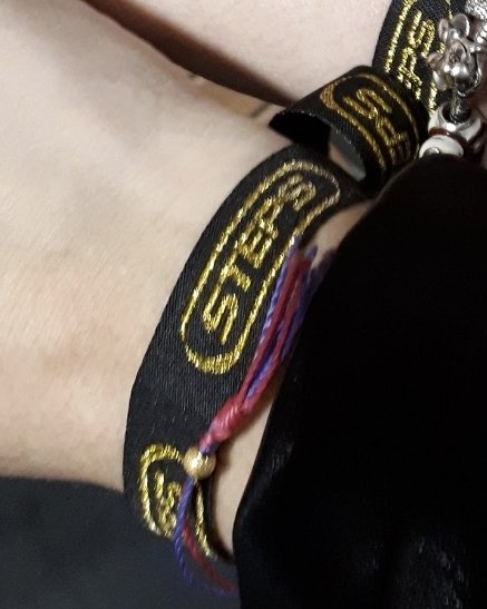 SuperChelle84's tweet photo. Internet, I need your help please. This black thread is all that is left of my beloved Steps wrist band from 2017. I'd love to get my hands on another...can anyone help?? @OfficialSteps @Ianhwatkins @_ClaireRichards @Faye_Tozer @LSLofficial @llatchfordevans #steps #bracelet https://t.co/ScvFkg3cY2