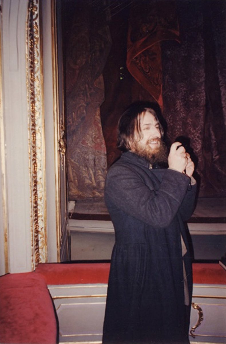 Alan__Rickman__'s tweet photo. Behind the scenes of “Rasputin”, November 1995

Marianne Dimant: “First they rehearsed - Alan Rickman dutifully drank the “poisoned Madeira” (which was actually grape juice) and ate the pastries. Three pastries, three glasses of juice. Then came “Attention, camera, action!”
Yusupov ran upstairs, grabbed the revolver, ran back down and there was Grigory Efimovich, sitting there alive and singing “Don’t fly, eagle, too close to the ground”.

Meanwhile, a pyrotechnician was lying on the floor on standby. Under Rasputin’s shirt was a complicated setup of wires connected to a bag of red paint. Felix fires the shot, the pyrotechnician remotely yanks the wires, the shirt tears, a bloody stain appears on the chest… but there’s no gunshot sound.
So, back to square one. They change Rasputin’s shirt, attach a new blood bag. Take two. More pastries, even more pastries, and more juice, of course. “Don’t fly, eagle…” Felix runs upstairs again, comes back with the revolver, raises his hand - the pyrotechnician pulls the wires, the shirt rips… still no gunshot. “Fuck!” yells Felix, furiously throwing the gun aside. By now Rickman is turning a bit green and whispers pathetically: “I’m feeling sick.” No wonder!

Take three. Back to positions. New shirt on Rasputin, Felix gripping the pistol so tightly his knuckles are white, the pyrotechnician is in position, everyone holding their breath. But no luck. This time Felix shoots successfully, but now there are problems with the pyrotechnics.
Third take, fourth, fifth - they keep changing shirts, adding fresh blood, more pastries, more Madeira (damn that stuff).

In the end: Alan Rickman heroically ate eighteen pastries (well, he didn’t finish all of them, but he took big bites out of many) and drank eighteen glasses of grape juice. The juice seemed to be coming out of Rickman’s ears and nostrils by that point, and someone even ran to the pharmacy for activated charcoal.

They finished off Rasputin the next day where they were supposed to, in the courtyard of the Yusupov Palace, on a frosty December evening. They got thoroughly chilled. But compared to the previous day’s pastries and juice, it was nothing. They generously covered Rickman in fake blood, and he fell into the snow about five times, struck by Purishkevich’s bullet.
That same evening we went to the Malaya Nevka and quickly dumped the Rasputin dummy from the bridge. We celebrated right there on the bridge, drinking ice-cold champagne.” (“g��rоd-812 ru”, December 2020)

Alan Rickman: “To the wooden bridge (the actual bridge) for the throwing over of Rasputin. Ten degrees below is a jaw-dropping temperature with gloves and coat off, so I hid in the car as much as possible. I hate last nights, last shots, goodbyes. Casual as possible is all I can do – hard in the face of an outpouring of affection from the Russian crew. Makes me wish we were here longer and with more sensitive leaders.
But the champagne and cake is a happy farewell as the circus moves on.”
(“Madly, Deeply: The Alan Rickman diaries”)