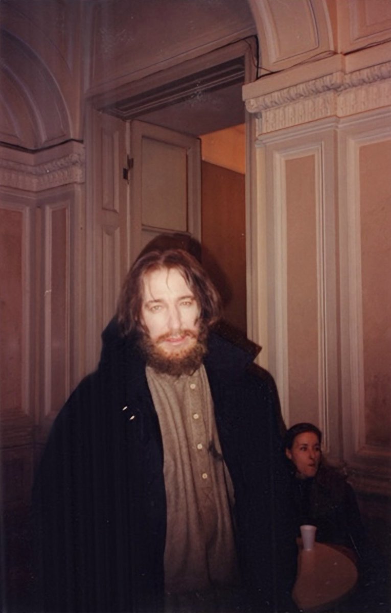 Alan__Rickman__'s tweet photo. Behind the scenes of “Rasputin”, November 1995

Marianne Dimant: “First they rehearsed - Alan Rickman dutifully drank the “poisoned Madeira” (which was actually grape juice) and ate the pastries. Three pastries, three glasses of juice. Then came “Attention, camera, action!”
Yusupov ran upstairs, grabbed the revolver, ran back down and there was Grigory Efimovich, sitting there alive and singing “Don’t fly, eagle, too close to the ground”.

Meanwhile, a pyrotechnician was lying on the floor on standby. Under Rasputin’s shirt was a complicated setup of wires connected to a bag of red paint. Felix fires the shot, the pyrotechnician remotely yanks the wires, the shirt tears, a bloody stain appears on the chest… but there’s no gunshot sound.
So, back to square one. They change Rasputin’s shirt, attach a new blood bag. Take two. More pastries, even more pastries, and more juice, of course. “Don’t fly, eagle…” Felix runs upstairs again, comes back with the revolver, raises his hand - the pyrotechnician pulls the wires, the shirt rips… still no gunshot. “Fuck!” yells Felix, furiously throwing the gun aside. By now Rickman is turning a bit green and whispers pathetically: “I’m feeling sick.” No wonder!

Take three. Back to positions. New shirt on Rasputin, Felix gripping the pistol so tightly his knuckles are white, the pyrotechnician is in position, everyone holding their breath. But no luck. This time Felix shoots successfully, but now there are problems with the pyrotechnics.
Third take, fourth, fifth - they keep changing shirts, adding fresh blood, more pastries, more Madeira (damn that stuff).

In the end: Alan Rickman heroically ate eighteen pastries (well, he didn’t finish all of them, but he took big bites out of many) and drank eighteen glasses of grape juice. The juice seemed to be coming out of Rickman’s ears and nostrils by that point, and someone even ran to the pharmacy for activated charcoal.

They finished off Rasputin the next day where they were supposed to, in the courtyard of the Yusupov Palace, on a frosty December evening. They got thoroughly chilled. But compared to the previous day’s pastries and juice, it was nothing. They generously covered Rickman in fake blood, and he fell into the snow about five times, struck by Purishkevich’s bullet.
That same evening we went to the Malaya Nevka and quickly dumped the Rasputin dummy from the bridge. We celebrated right there on the bridge, drinking ice-cold champagne.” (“g��rоd-812 ru”, December 2020)

Alan Rickman: “To the wooden bridge (the actual bridge) for the throwing over of Rasputin. Ten degrees below is a jaw-dropping temperature with gloves and coat off, so I hid in the car as much as possible. I hate last nights, last shots, goodbyes. Casual as possible is all I can do – hard in the face of an outpouring of affection from the Russian crew. Makes me wish we were here longer and with more sensitive leaders.
But the champagne and cake is a happy farewell as the circus moves on.”
(“Madly, Deeply: The Alan Rickman diaries”)