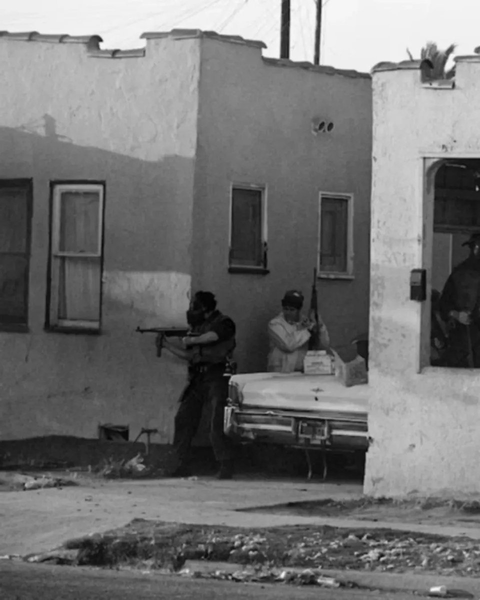 American Policeman using MP40, during a firefight with SLA in Los Angeles, May 1974.