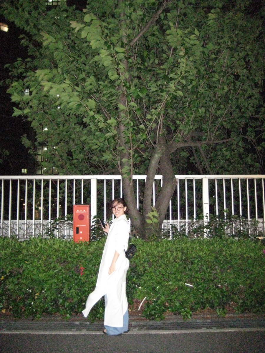 Nayeon's random photos laughing in the street at night? 😭