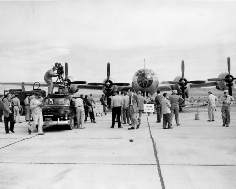 AtomicMuseum's tweet photo. Newsreel crews gather at the Nevada Proving Ground to film the decontamination of a B-29. These "Open Tests" invited the media to witness specific milestones, educating the world on both the power of the atom and the rigorous safety protocols used to manage it. https://t.co/0Z6QcZnDUS