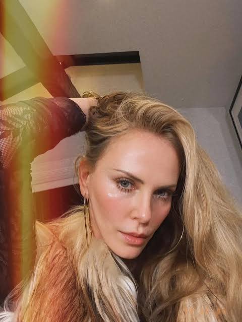 charlize theron tweet media