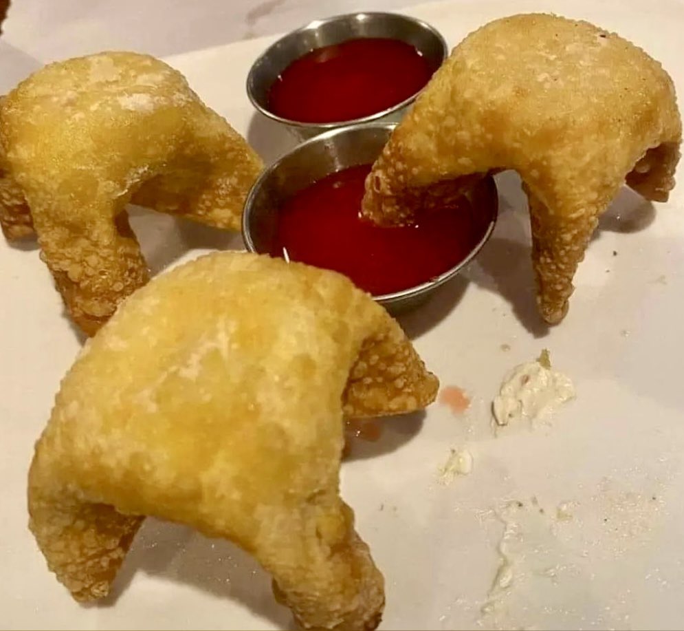 Here we see Crab Rangoons in their natural state drinking from a Sweet and Sour Sauce watering hole… unaware of the predator that lurks above them.