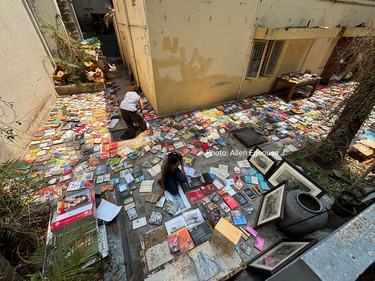 DarshanDevaiahB's tweet photo. Loss is loss: Bookworm Bookshop dries rain-soaked books after flooding. Photo by @iallenegenuse / The Hindu. https://t.co/VkCT7KmDHL