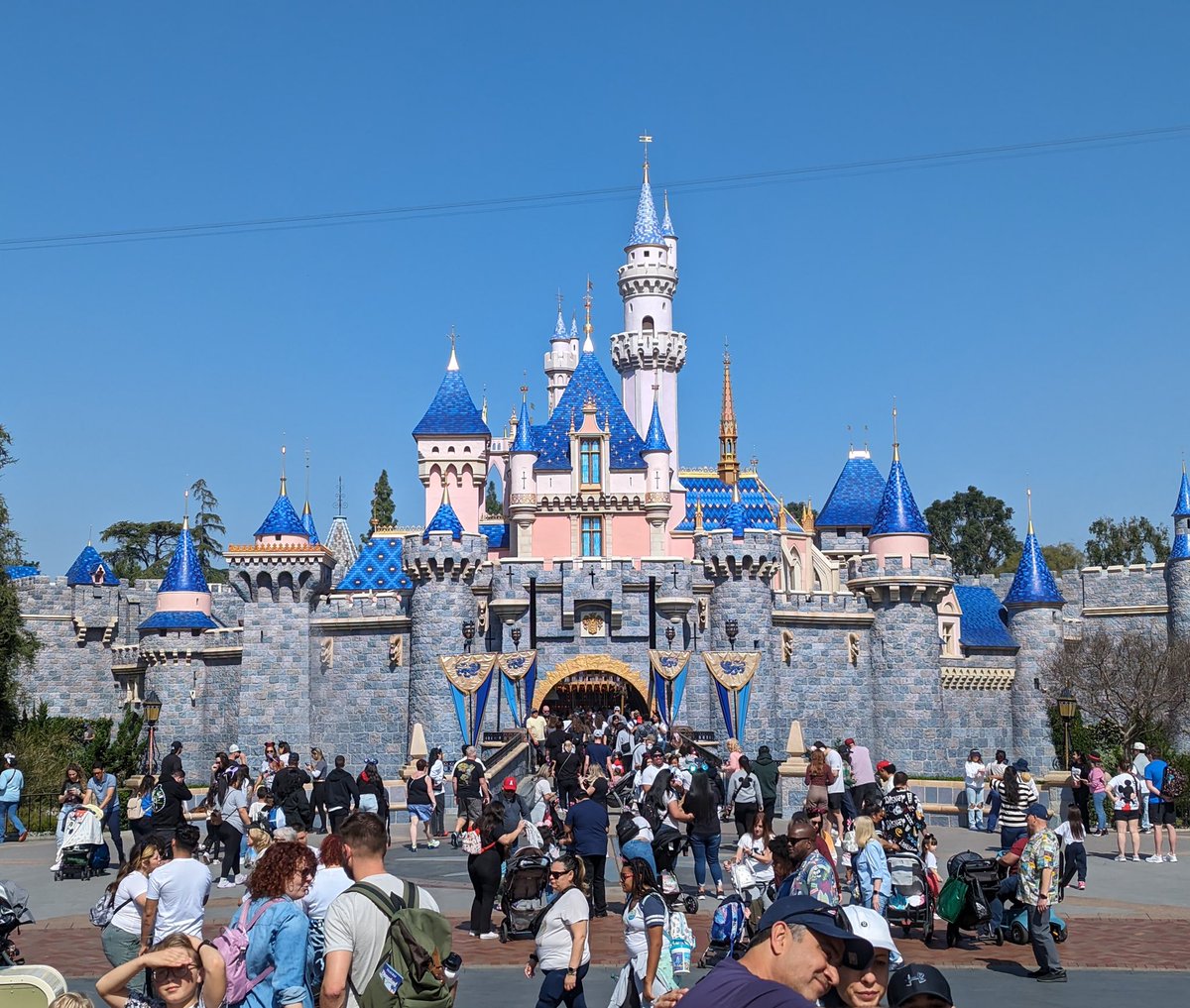 Breaking911's tweet photo. Disneyland Tightens Rules After Spike in Ride Disruptions

Disneyland Resort in Anaheim is introducing a stricter guest code of conduct aimed at reducing ride shutdowns caused by guest behavior. Park officials say disruptions linked to guest actions accounted for 13% of ride stoppages in fiscal year 2025, up from a historical average of 10%.

A new phone policy dubbed “Stow it, Don’t Show it” requires guests to fully secure phones before boarding certain high-motion attractions, with cast members checking compliance before dispatch. The rules also target loose items like large tumblers and backpacks, expand bans on selfie sticks and similar devices, and tighten enforcement at entry points as the park seeks to improve safety and ride reliability.