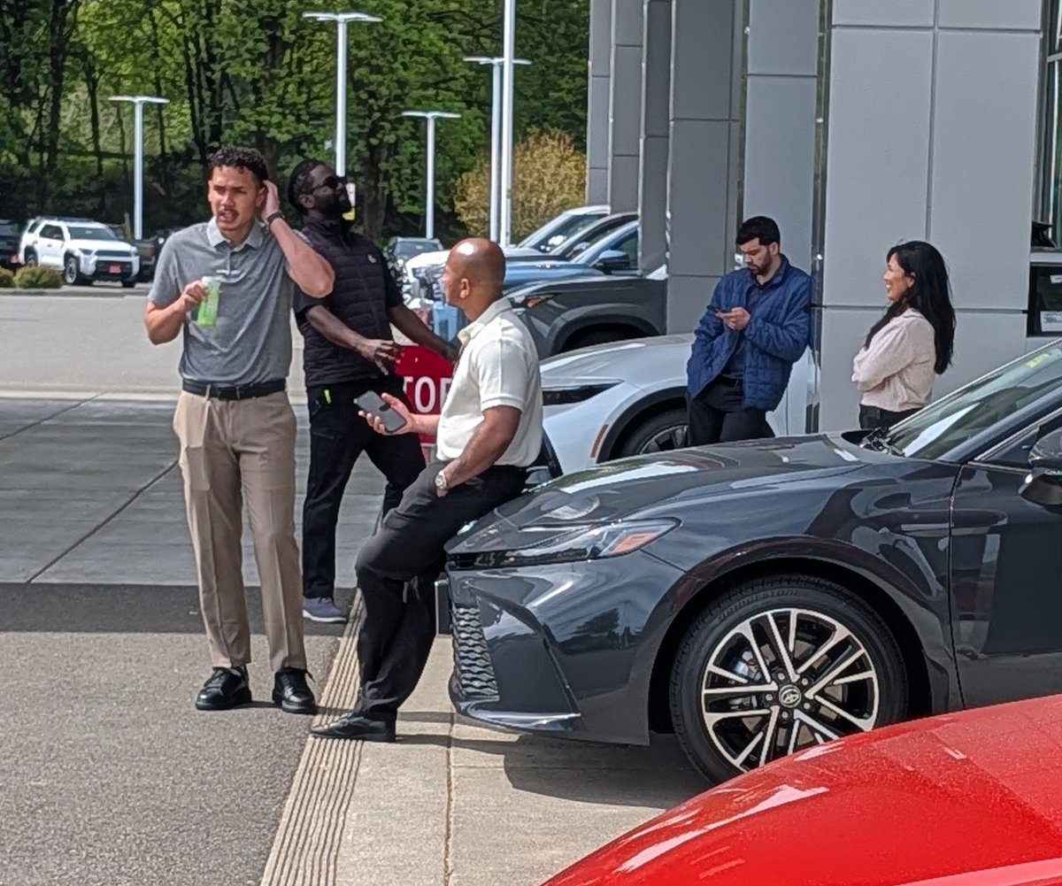 MarkNomada's tweet photo. This is all you need to know about these crooks @ToyotaofOlympia get these lazy asses some chairs so they don't sit on new cars... https://t.co/eqspqIxmXn