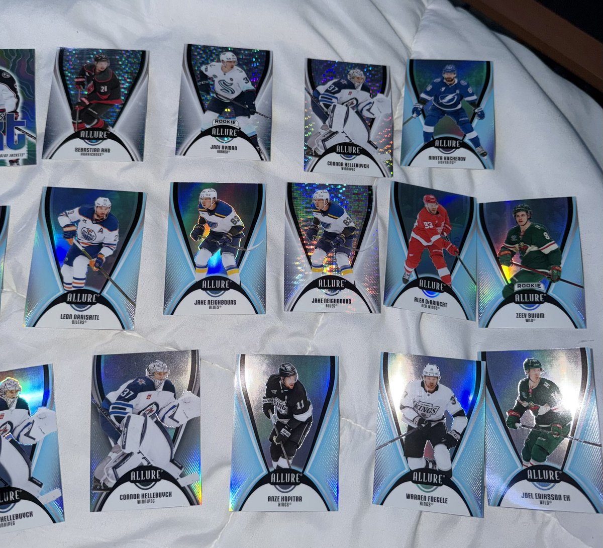 Anyone interested in trading hockey cards? These are my extras from the Upper Deck Allure 25-26 blaster box, looking for mainly Flyers players and a few other players. Dm me