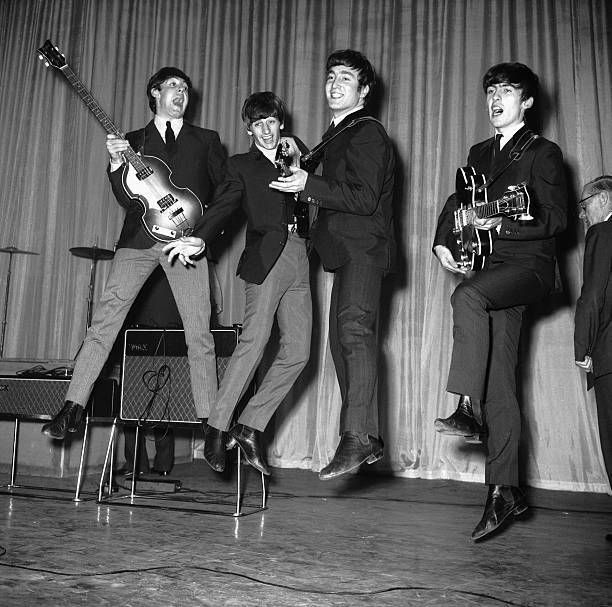 Paul, Ringo, John, and George mid-jump with their instruments in 1963. The British press loved asking the band to jump for photos during the early days of their breakout success, leading to fun archival shots like this one.