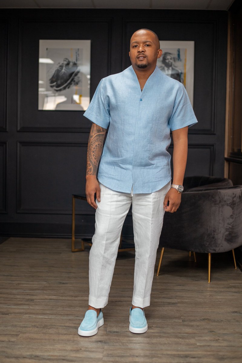 A Relevance For Men Linen Safari, an open Chinese Collar shirt with Hidden Buttons paired with our Powder Blue Moccasins💙🤍 

relevanceformen.co.za/collections/re…