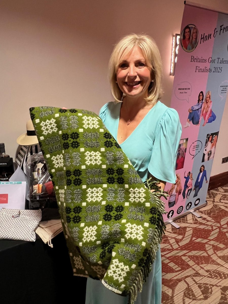 TirGlasCymru's tweet photo. We donated one of our blankets for the charity auction at the Women in Wales Awards 2026. Kindly displayed by Siân Lloyd of the BBC https://t.co/T4QH1YZ18y #MHHSBD #welshblankets https://t.co/OCldMct3tI