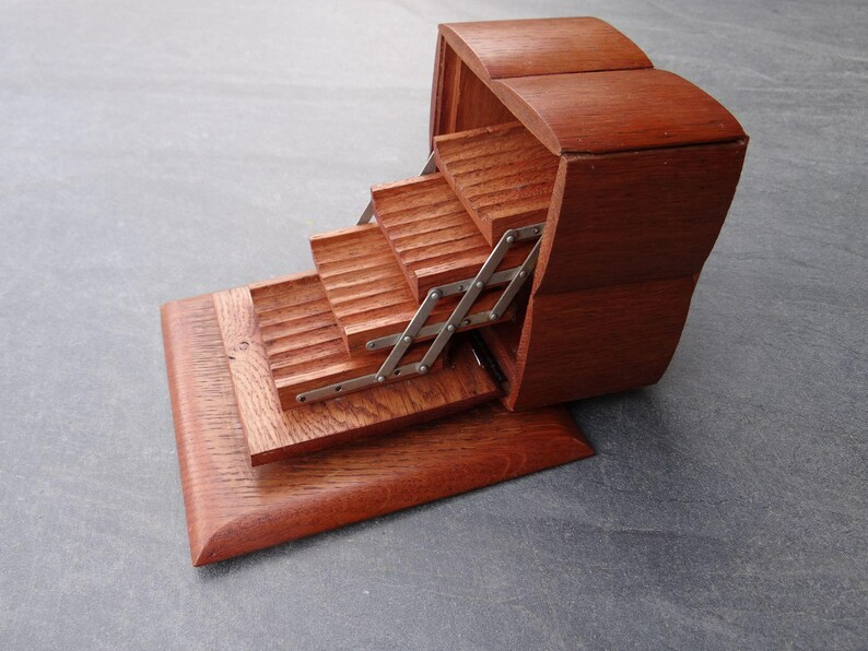 elementsdeco's tweet image. Vintage Wooden Cigarette Holder &amp;amp; Display Case 
Beautiful 4-tier stepped cascade design with smooth scissor mechanism. Rich warm wood tones.  A true mid-century gem for collectors!  authenticbyclaire.etsy.com/listing/449772… #Vintage #CigaretteCase #WoodenBox  #EtsyFinds #tobaccoEnthusiasts