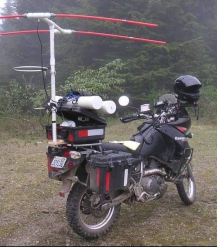 cqcqcqdx's tweet photo. KA9PGC Johns motorcycle HF mobile. a customized Kawasaki KLR650 motorcycle set up for amateur radio operations. The bike is fitted with a large Yagi antenna mounted on a PVC pipe mast. https://t.co/Rh9fRGpShz