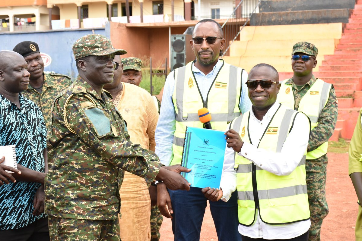 NCSUganda1's tweet photo. Gulu, Lira
 Training 
 Grounds
 Sites
 Handed
 Over Too 
🇺🇬🇺🇬🇺🇬🇺🇬

Having handed over the Boma Ground of Hoima and King George Stadium of Masindi to the UPDF Engineering Brigade a  couple of days earlier, the National Coucil of Sports (NCS) has today followed suit with Pece Stadium, Gulu University and Lira University grounds. 
All three ceremonies were once again presidied over by the Minister of State for Education and Sports in charge of Sports, Hon. Peter Ogwang, flanked by the NCS Board Chairperson Ambrose Tashobya and General Secretary Dr Bernard Patrick Ogwel.
The trio underlined government's commitment to countrywide sports infrastructure development and to the success the Pamoja AFCON 2027, reiterated the importance of that infrastructure in the Acholi and Lango sub regions naturally endowed with people of great athletic qualities, called on the private sector in the country to also seize the opportunity and pull it's weight ahead of all the major international sports events coming to these facilities, and urged consultants Ministry of Works and Transport and contractors UPDF to do everything possible to meet the six-month project timelines.
These committments and calls were made in the presence of political heads including Hon. Martin Ojara Mapenduzi (MP Bardege-Layibi County), District and City political and administrative leaderships, the university hierarchies in Gulu and Lira led by the representatives of the Vice Chancellors, NCS top management, the Ministry of Works team led by Eng. Henry Lubega, the contractor's team led by Lt. Col. Peter Seku Kidemuka, area locals, and media.
The training grounds in Gulu and Lira are attached to the Akii-Bua Olympic Stadium, for which the construction has made major strides in the last few months.