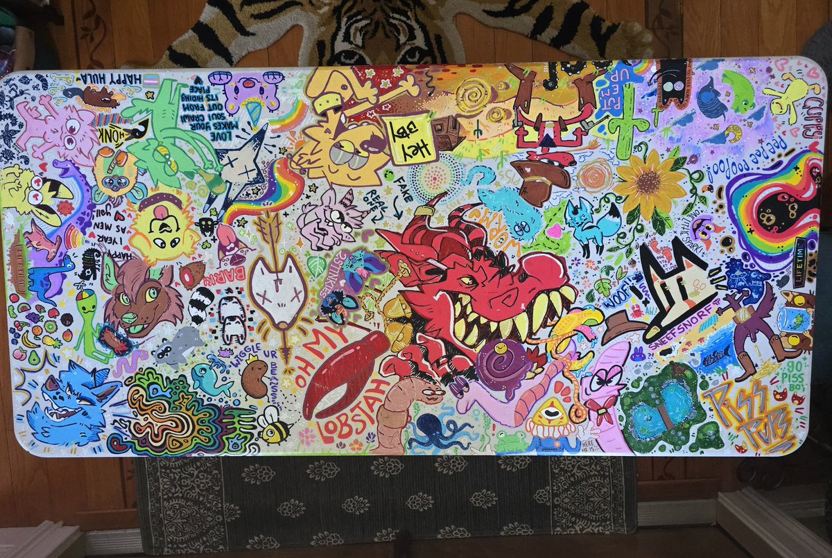 KiisCreatures's tweet photo. The friend table!🌈

I'd like to share a piece of furniture that is very important to me! This is a cheap plastic camping table that was turned into a beautiful work of collaborative art between a bunch of buddies that have come to our house in...2023 i think? ILOVEMYFRIENDS!!!! https://t.co/tsmAI5D0sL