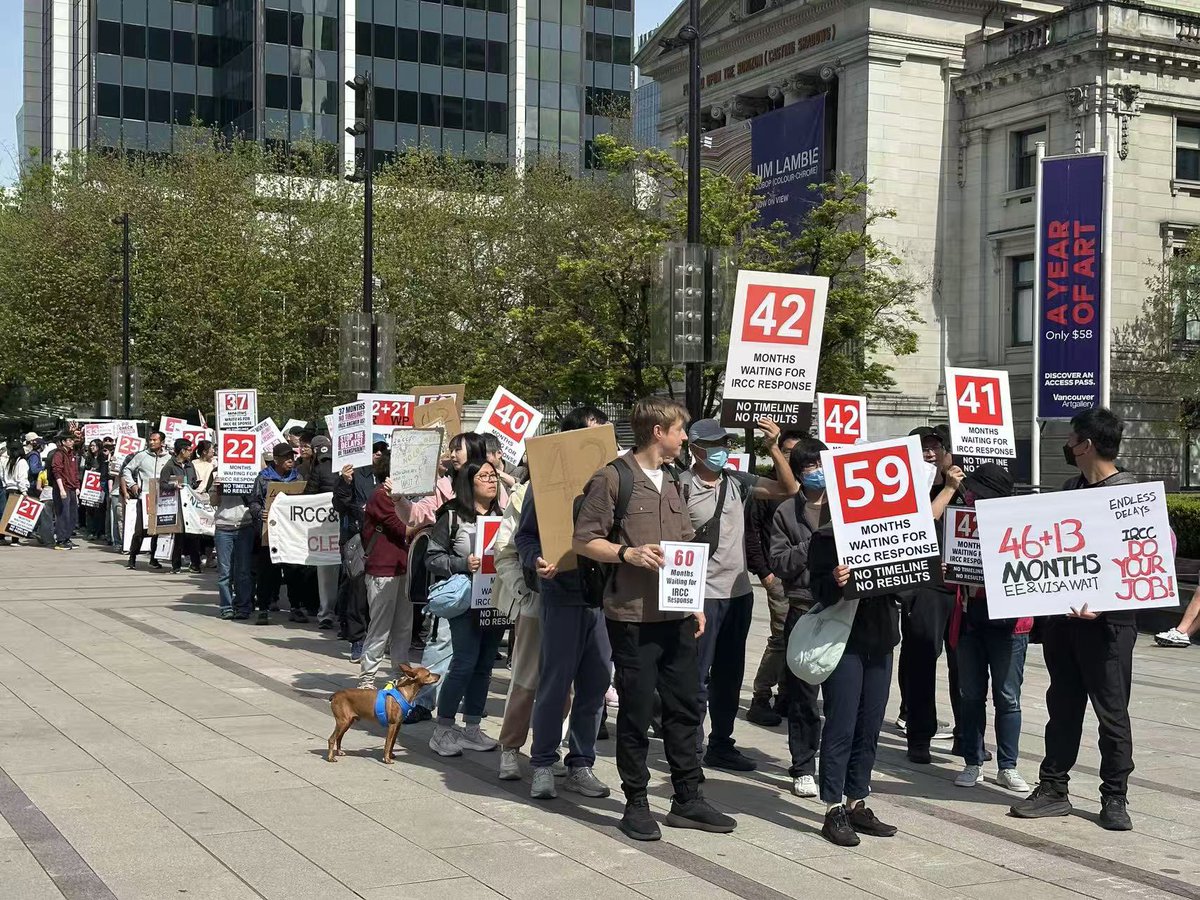 VoicesFairCheck's tweet photo. The main group is currently heading towards the IRCC office, marching silently through the streets. We have come from all across Canada; thank you to everyone for your participation and support. https://t.co/u2WGld4TjA