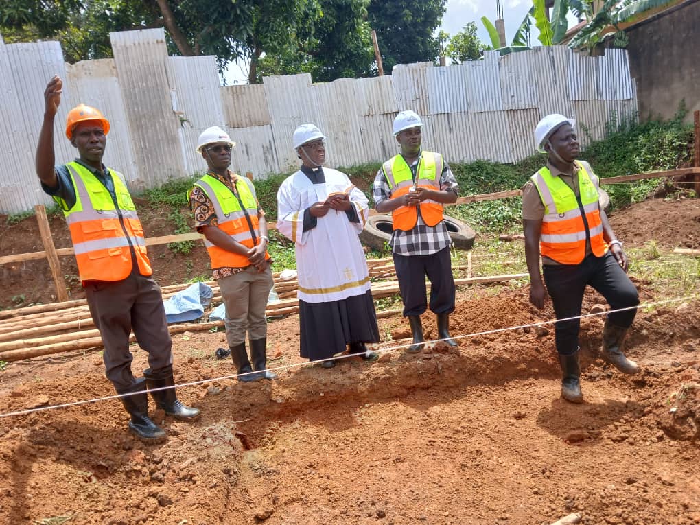 HCDiocese's tweet photo. Fr. James Aliomu Finance Administrator, Fr. Stephen Asiimwe, Land Officer &amp; Eng Yiga witnessed the function. @Hotel will contain 7 levels/floors, including the parking basement, supermarket (banking hall), restaurant, conference hall, 3 levels of guest houses&amp; a health club. https://t.co/apzxk9RoQy