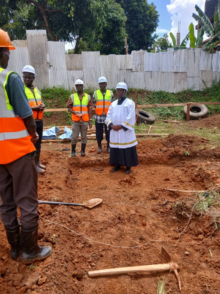 HCDiocese's tweet photo. Fr. James Aliomu Finance Administrator, Fr. Stephen Asiimwe, Land Officer &amp; Eng Yiga witnessed the function. @Hotel will contain 7 levels/floors, including the parking basement, supermarket (banking hall), restaurant, conference hall, 3 levels of guest houses&amp; a health club. https://t.co/apzxk9RoQy