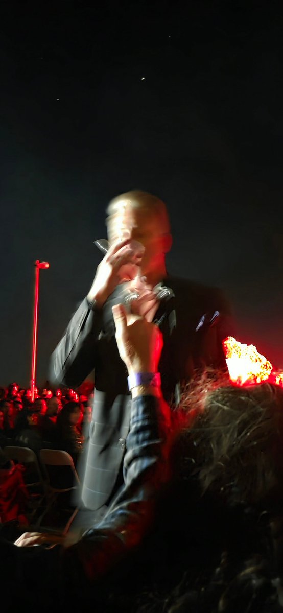 moonsconfidant's tweet photo. I was within 2 feet of Josh. It was blurry because my hands were freezing. I was not prepared for the desert winds. #qotsa https://t.co/la2FcApdzQ