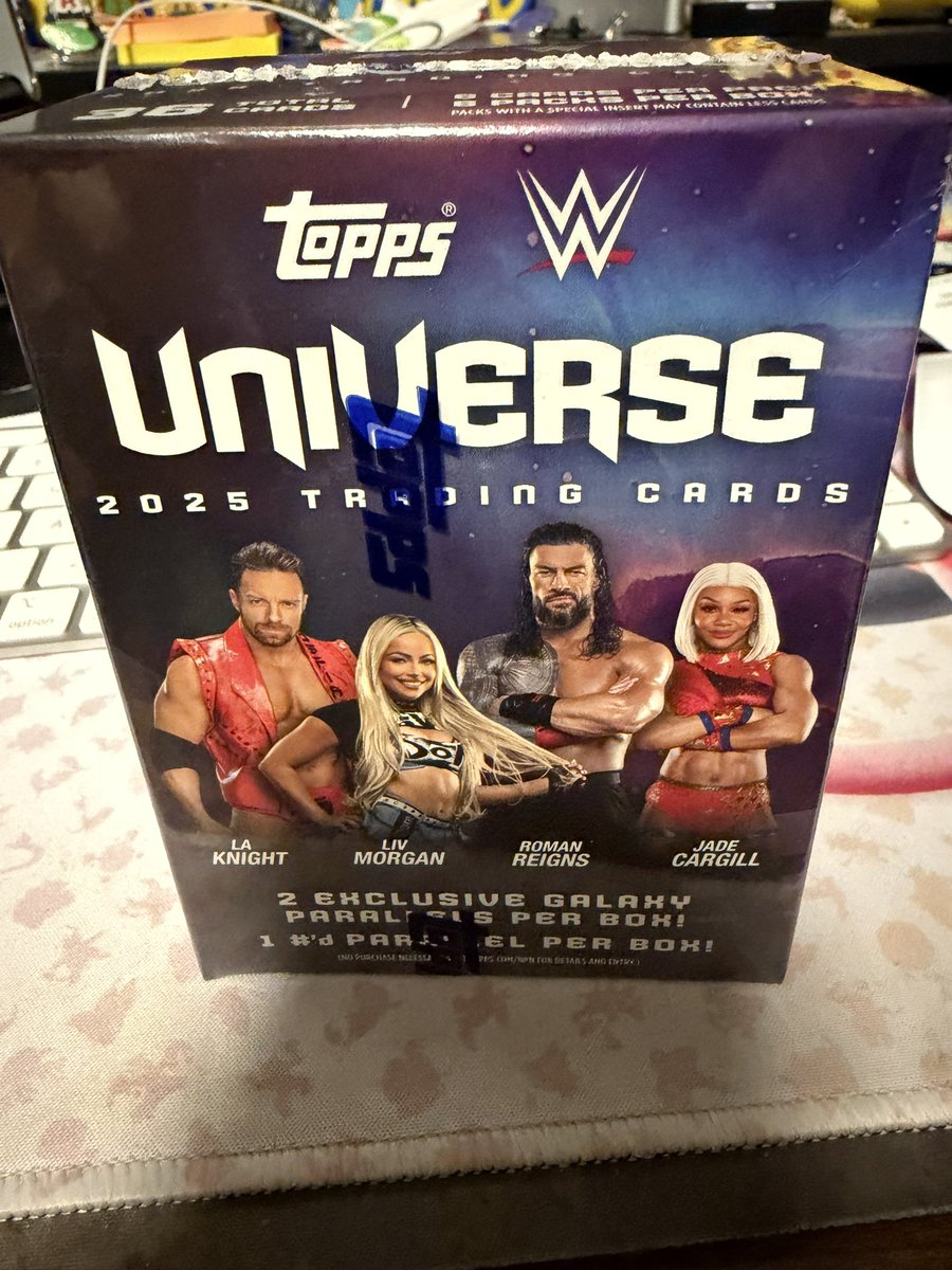 DonFUBAR's tweet photo. @Topps hey Topps, what gives? Found a box of WWE Universe 2025 in the wild and while the box says “2 Exclusive Galaxy Parallels Per Box!” and “1 #’d Parallel Per Box!” this box had 3 Galaxy Parallels and 0 #’d Parallels 🤷🏻‍♂️ https://t.co/PtGSZBx4Yu