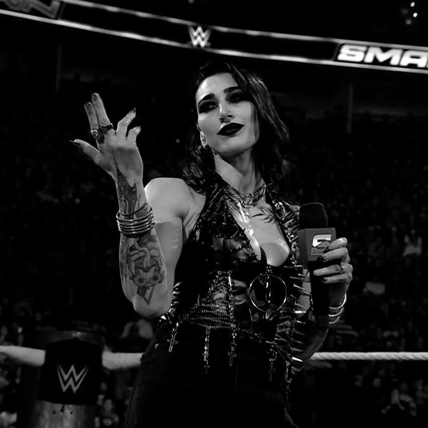 RhiAndroid1990's tweet photo. I need to know what brand of black lipstick @RheaRipley_WWE uses because that stuff STAYS 🖤😭 https://t.co/4EeuNfKd6N