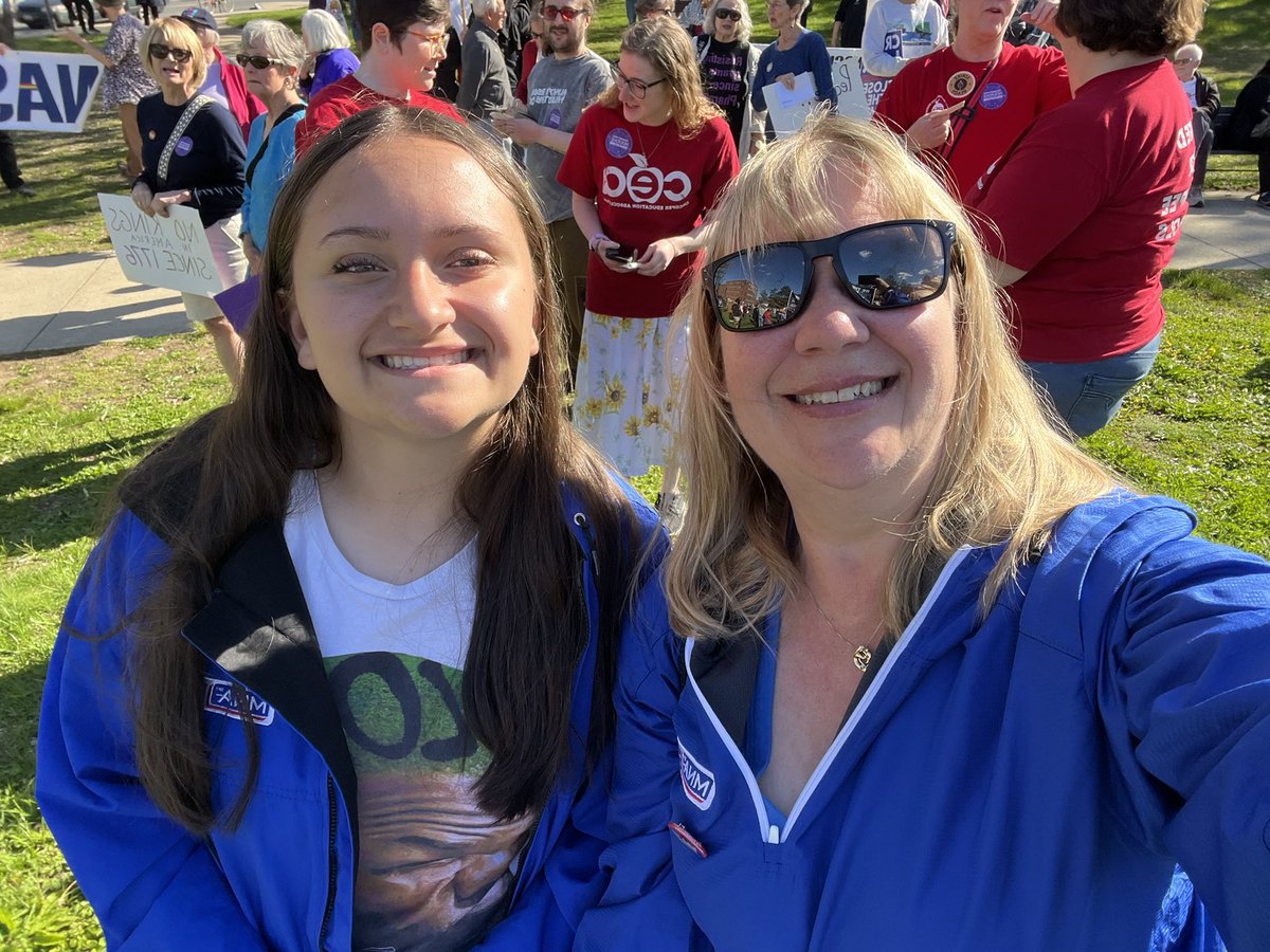 MassNurses's tweet photo. MNA Member Mary Koch-Rodriguez and her daughter Addison Rodriguez at the Holyoke May Day Action, where not only did we march for Workers over Billionaires but also marched in solidarity with the Holyoke Educators. 

Great event with hundreds of people! 

#mayday https://t.co/jMqfbOv0Rg