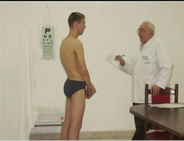 Down to nothing but his briefs for his physical