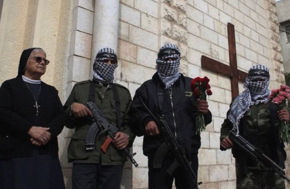MeLive007's tweet photo. Hamas fighters protecting a church and a Catholic nun. 

Why haven’t I seen this photo before? https://t.co/ZFUEnN6q8z