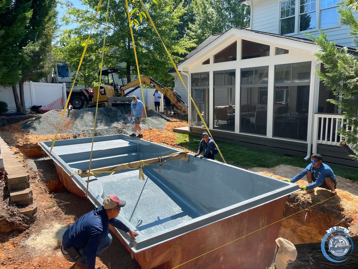 PoolscapesCLT's tweet image. The installation of the Wylela Beach #fiberglasspool model.  The Wylela Beach features a built-in tanning ledge with steps leading to the shallow end of the #pool.  The pool featured is in the Granite #poolcolor option.