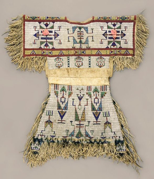 womensart1's tweet image. Sioux beaded hide dress c.1880, clothing encoded with meaning relating to the wearer, such as status and family #WomensArt