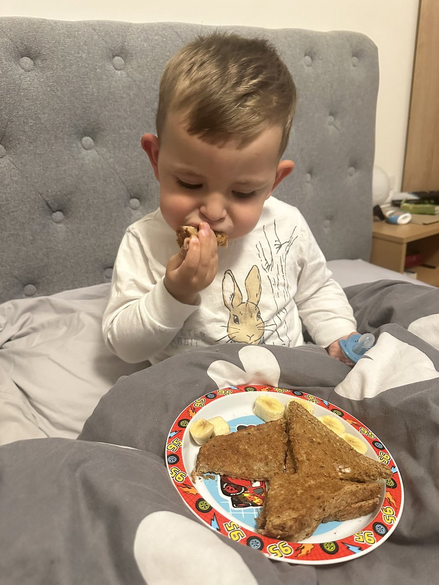 cazzag96's tweet photo. Lay in bed with the nephew and he says “Caroline, I hungry”. Best believe he got a slice of toast (one was for me), banana and milk 🥺 
Then I realised I forgot to give him supper and the guilt was strong 😭
He’s now polished off his supper and is back to lying in bed ❤️ https://t.co/cHs1JY55jL
