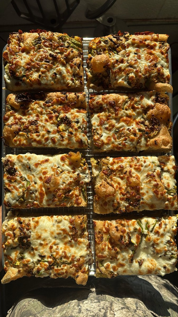 Focaccia w/ local asparagus, Brussels, sweet corn, calabacuta, garlic, &amp; mozz :)