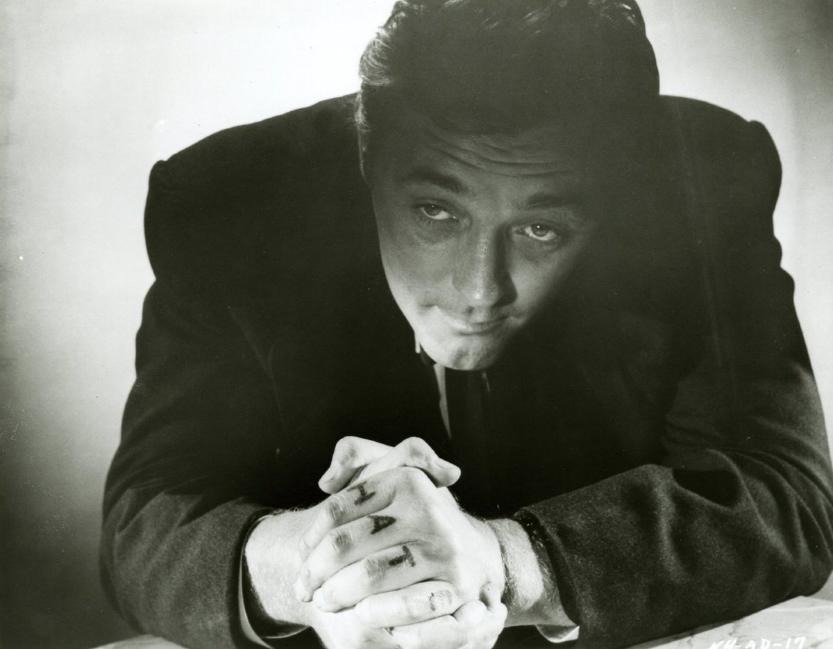 LISAGNO's tweet image. Mitchum's role in Night of the Hunter (1955) was a commercial failure, but today is regarded as one of the greatest films of all time, and one of the best performances of his career. Critic Robert Ebert said Mitchum was his favorite movie star and the soul of #FilmNoir "with his