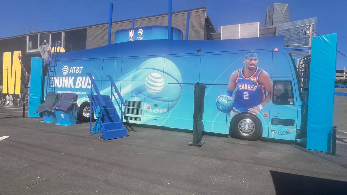 LouisMGreen's tweet photo. What is this AT&amp;T Dunk bus parked by the Adidas SGA MVP mural? https://t.co/QsqllBXVAS