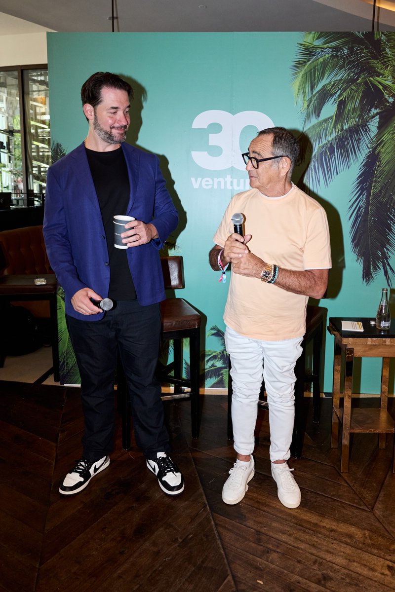 alexisohanian's tweet photo. I had a great morning at Possible last week: fireside chat about how to survive the dead internet, signed one of my Topps trading cards for an attendee, and I was generously gifted some custom Angel City FC / Chelsea Nikes (thank you!!) https://t.co/DsLgPKwI8B