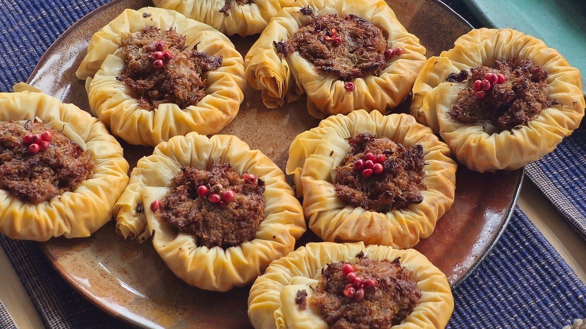 #SeasonOfHappiness Phyllo nests with pork.