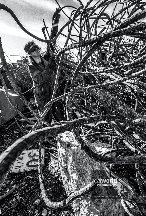 RealWorldImage's tweet image. A worker cuts rebar at a metal scrapyard in Kelowna, British Columbia, Canada in the nineties. Gary Moore photo. Real World Photographs. #streetphotography #Canada #Grok #Nikon #photojournalism #realworldphotographs #Kelowna #BC #BritishColumbia #garymoorephotography